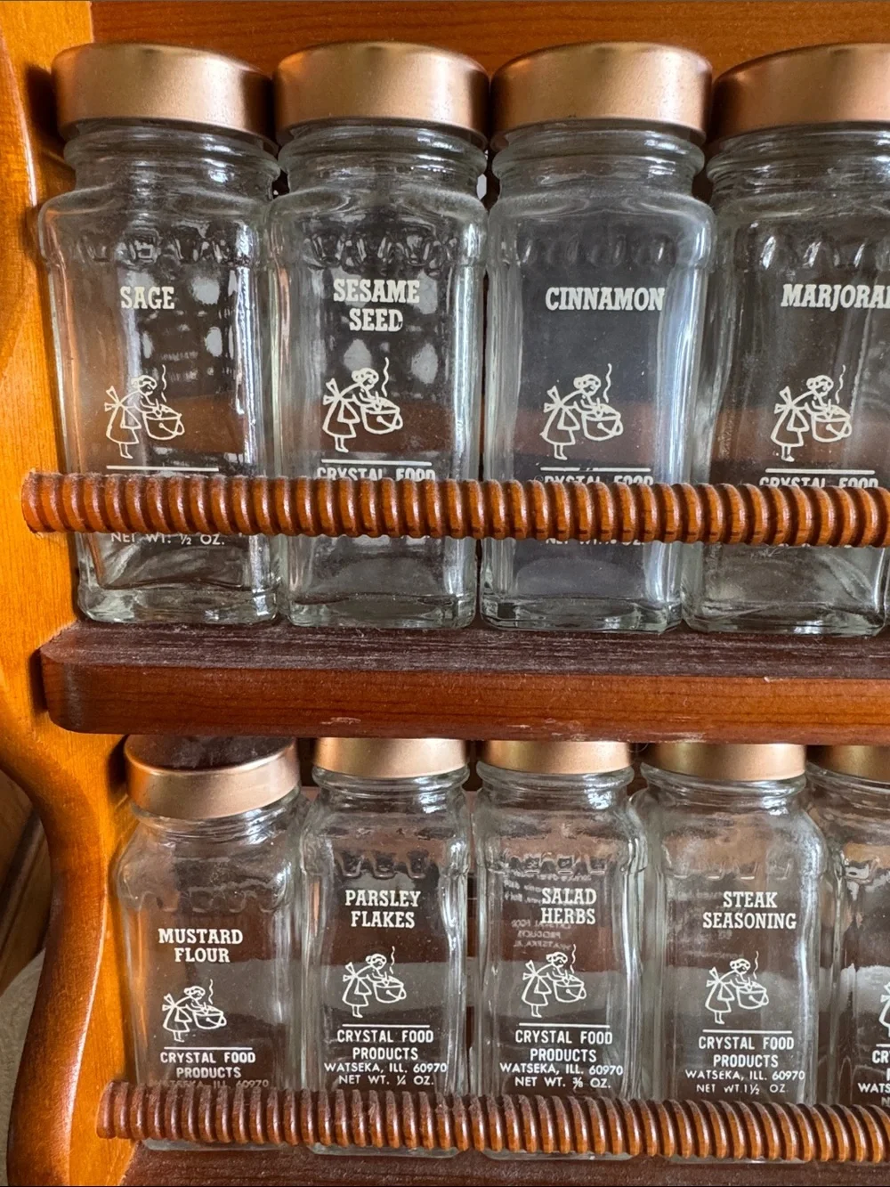 Vintage Glass Spice Jar Set with Copper Lids on Wooden Rack
